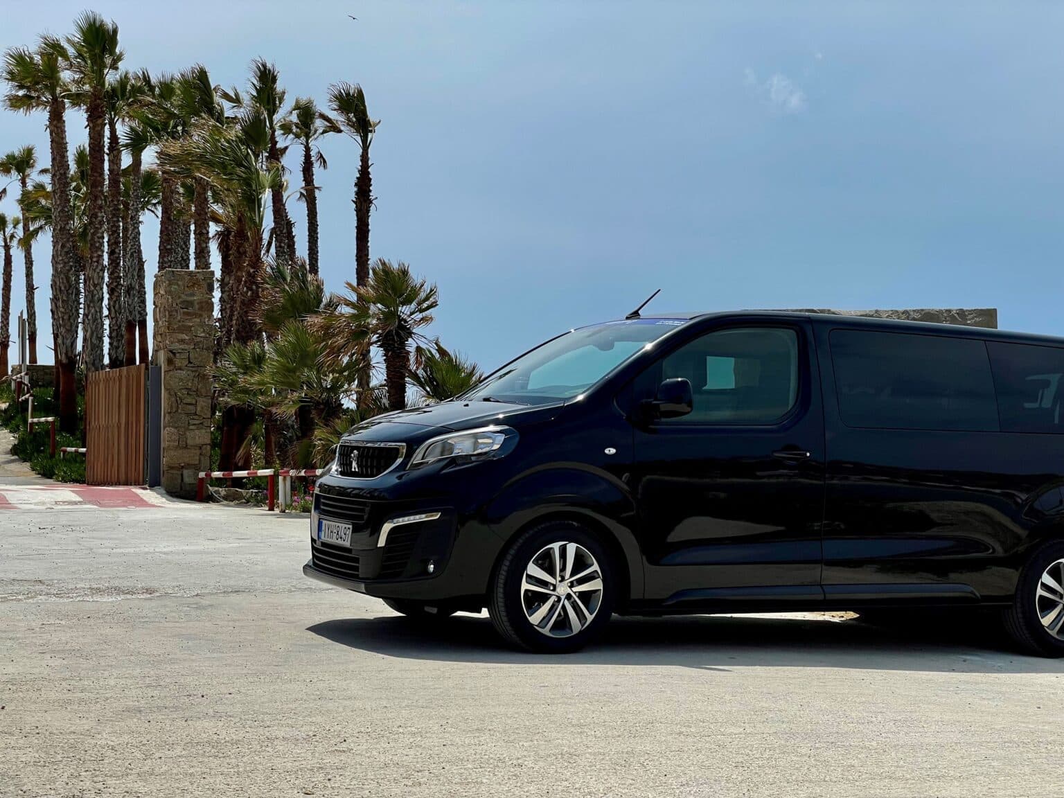 Island Chauffeur Peugeot Traveller parked in Mykonos